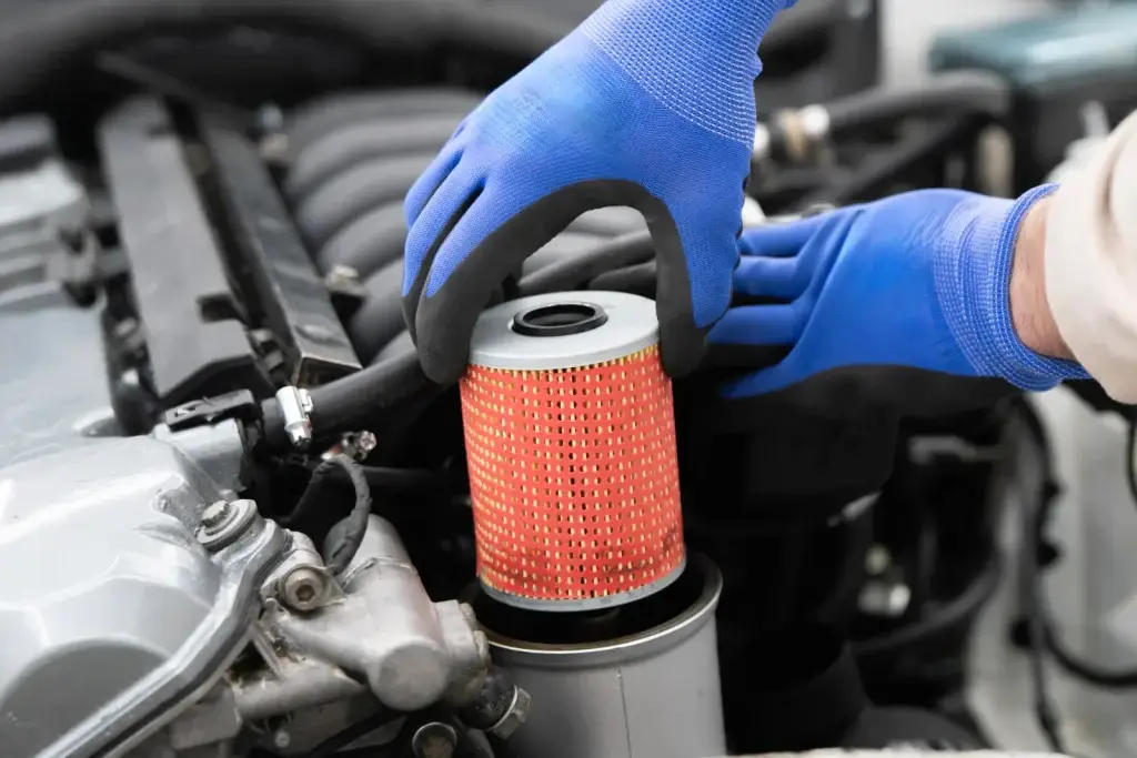 Mechanic replacing an oil filter